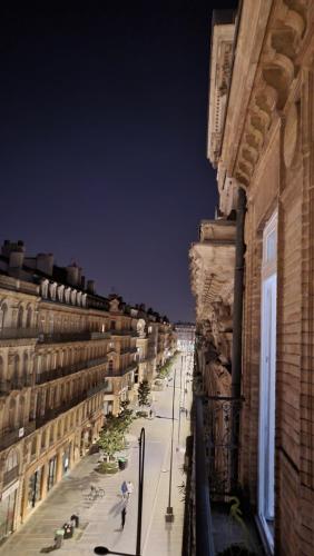 a view of a city street at night with buildings at Cœur Capitole 122m2- Clim - Parking - Ascenseur- Métro in Toulouse