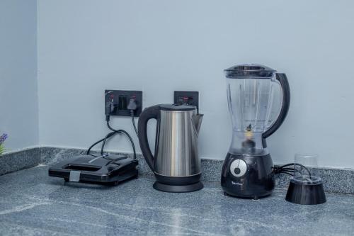 a blender sitting on top of a counter at Aija Residences in Abuja