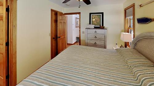 a bedroom with a bed and a dresser at Wolfe's Way in Franklin