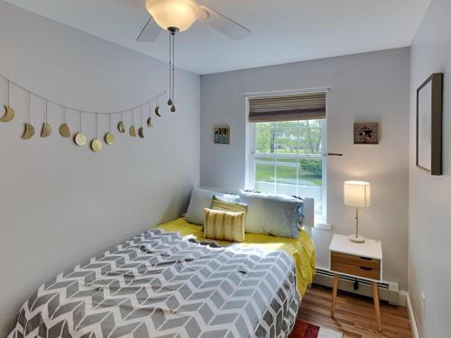 a bedroom with a bed and a window at Saco Sanctuary in Saco