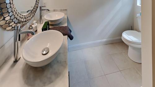 a bathroom with a sink and a toilet at Saco Sanctuary in Saco