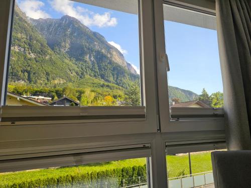 a window with a view of a mountain at Motel 96 in Balzers