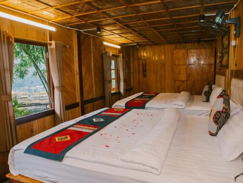 Postel nebo postele na pokoji v ubytování H'Mong Cát Cát Homestay