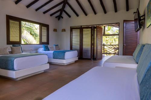 Gulta vai gultas numurā naktsmītnē Coconuco Beach Palomino