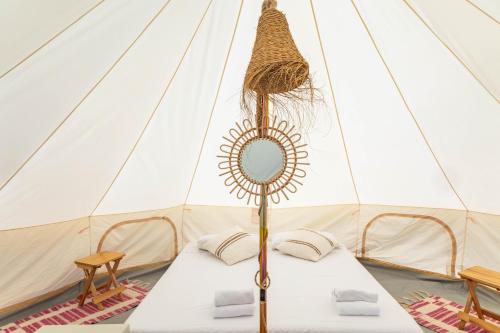 a room with two beds in a tent at HolaCamp Sant Salvador in Comarruga