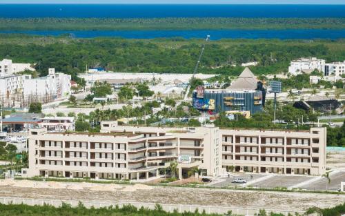 an aerial view of a building in a city at Probar Suites Punta Cana in Punta Cana