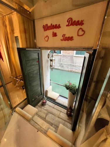an overhead view of a door and a window with a plant at Venice Luxury Watersdoor in Venice