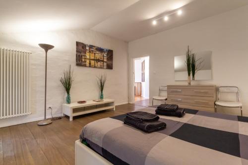 a bedroom with a bed with two bags on it at Attic floor venice apartment in Mestre