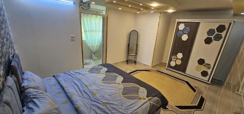 Una cama o camas en una habitación de ستوديو مستقل داخل فيلا