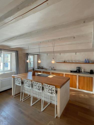 a kitchen with a large wooden table and chairs at Stone House Orsera in Vrsar