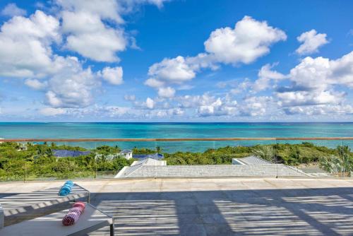 a view of the ocean from a balcony at Villa Skyline 5 Bedroom stunning Ocean View in Providenciales