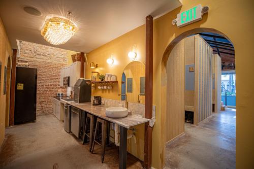 a large kitchen with a counter in a room at Social Stays - Santa Barbara's FIRST hostel on State Street in Santa Barbara