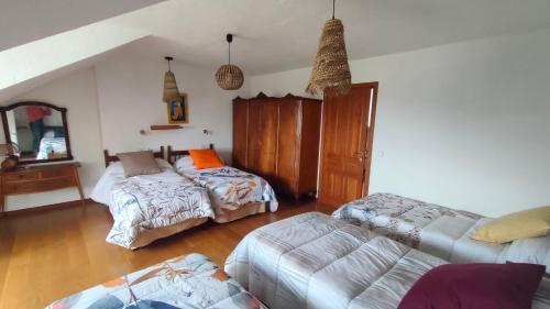 a living room with a couch and a bed at El huerto de la Reina in Becerril de la Sierra