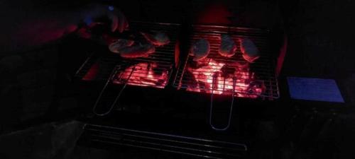 an open oven with red lights in it at L'Oustal in Montech