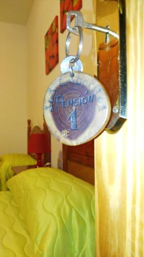 a condom hanging on a hook next to a bed at Pensión Amparo Las Hayas in Valle Gran Rey
