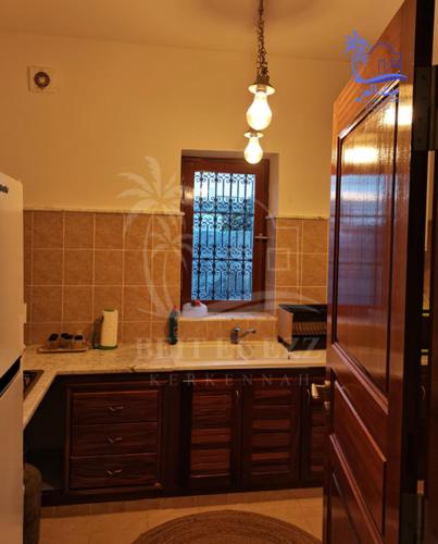 Una cocina o cocineta en Beit El Ezz - Les Suites