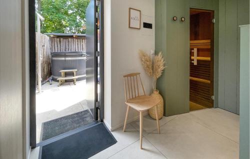 a chair sitting in theoyer of a house at Pet Friendly Home In Ballum With Sauna in Ballum