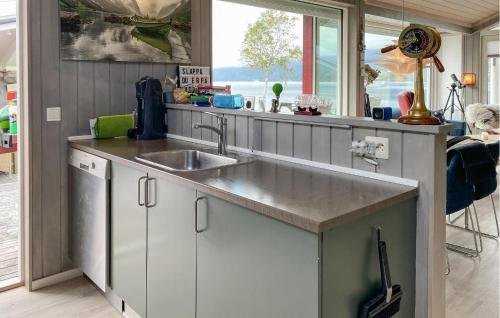 a kitchen with a sink and a counter at Beautiful Home In Eidsvåg I Romsdal in Eidsvåg