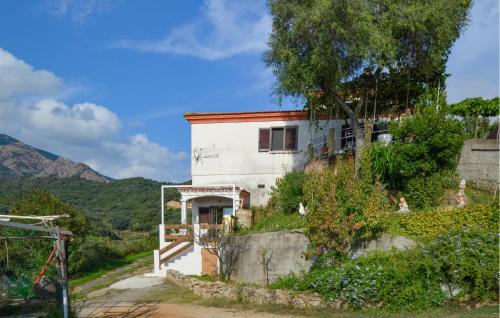a house on the side of a hill at Lovely Apartment In Sarrola Carcopino in Sarrola-Carcopino
