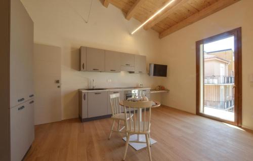 a kitchen with a table and chairs in a room at Lovely Apartment In Realmonte in Realmonte