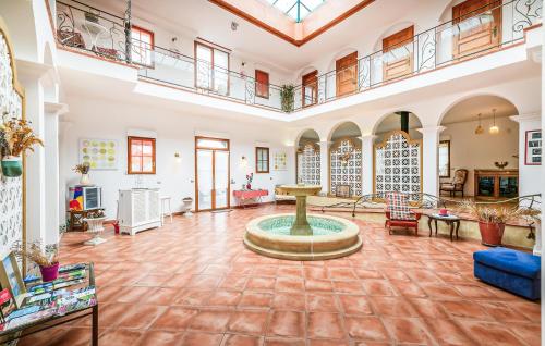a large room with a fountain in the middle of it at Beautiful Home In Saint-Cyr-Sur-Loire in Saint-Cyr-sur-Loire
