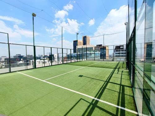 a tennis court on top of a building at Polanco Signaturepool, Paddle, Jacuzzi, 150mbs in Mexico City