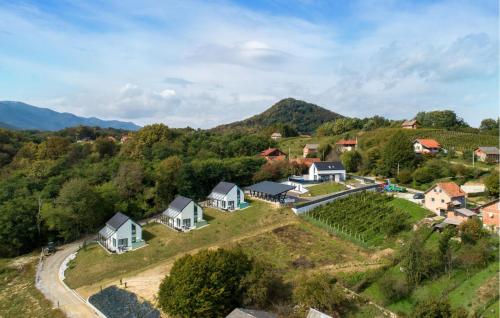 a village on a hill with houses and a road at Amazing Home In Margecan With Wifi in Gačice