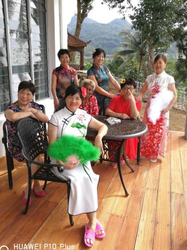 a group of women posing for a picture on a porch at Suva Hideaway Villa in Suva