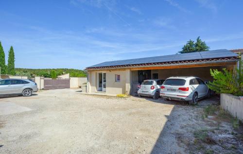 a house with two cars parked in front of it at Stunning Home In Noves With Wifi in Noves