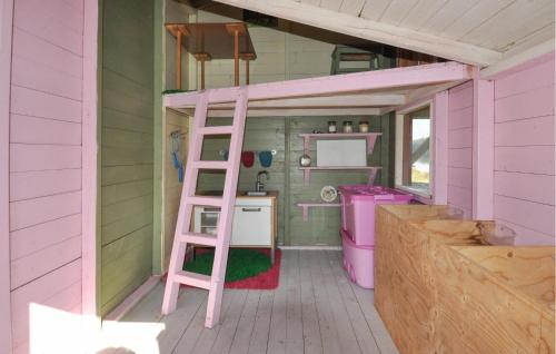 a pink ladder in a tiny house with a kitchen at Stunning Home In Degerfors With Sauna in Degerfors