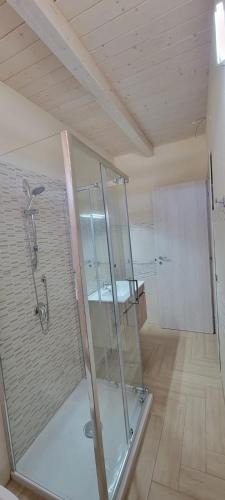 a bathroom with a glass shower in a room at Appartamenti Vincenzo Lampedusa in Lampedusa