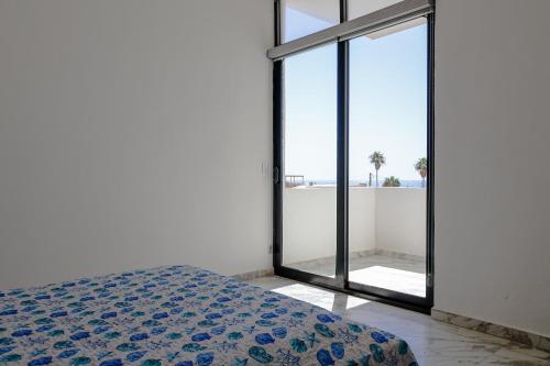 Ένα ή περισσότερα κρεβάτια σε δωμάτιο στο Calle de Las Sirenas