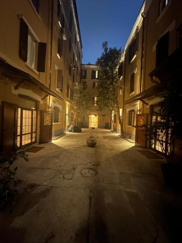 an empty alley in a building at night at First Moon-Emme Loft in Milan