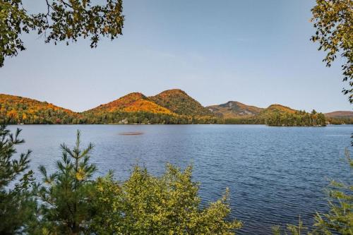 a view of a lake with mountains in the background at Suite with mountains view & Resort access in Lac-Superieur