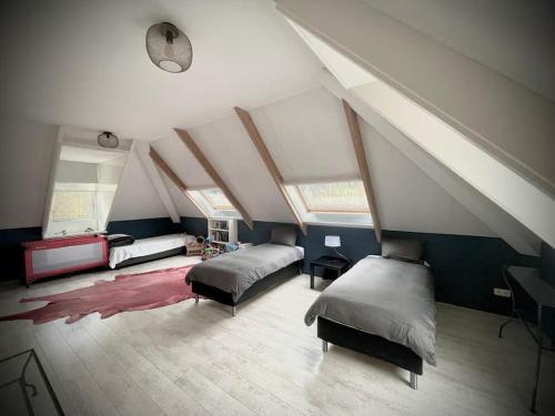 Ένα ή περισσότερα κρεβάτια σε δωμάτιο στο Luxe vakantievilla met jacuzzi