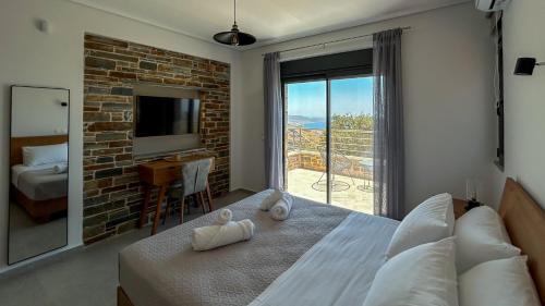 Ένα ή περισσότερα κρεβάτια σε δωμάτιο στο Drys Villas Mekoynida