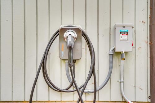 a pay phone is attached to a wall at Hot Tub and Fireplace Peaceful Anderson Island Home in Johnson Landing