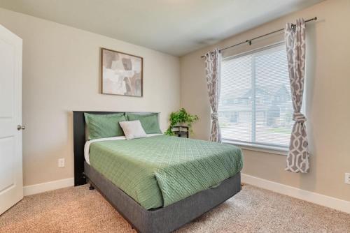 a bedroom with a bed and a window at Family friendly 5bd3bath 3CarGarage GameRoom in Cimarron Hills