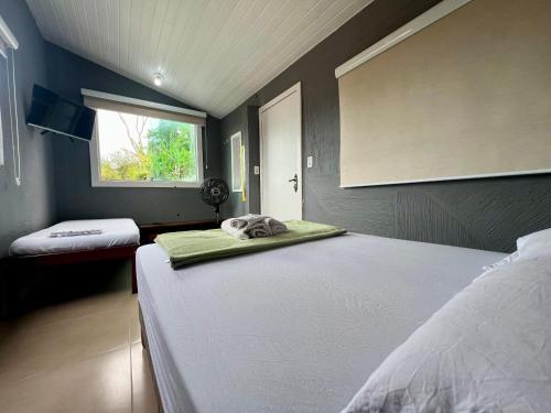 Postel nebo postele na pokoji v ubytování Espaço Verano- quarto Família
