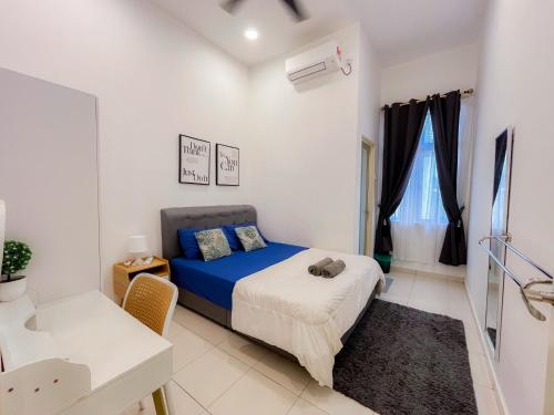a small bedroom with a bed and a window at KotaSas Summer East Persint 5 by AHM Home in Kuantan
