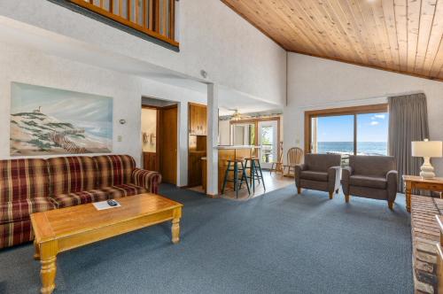a living room with a couch and a table at The Lodges at Breezy Point in Breezy Point
