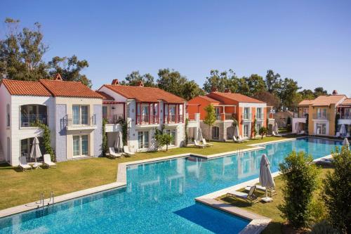 an image of a house with a swimming pool at IC Hotels Santai Family Resort - Kids Concept in Belek
