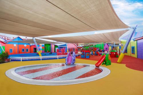 a childrens play area with a sprinkler in a playground at IC Hotels Santai Family Resort - Kids Concept in Belek
