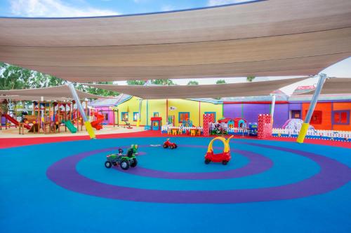 an image of a playground with cars and rides at IC Hotels Santai Family Resort - Kids Concept in Belek