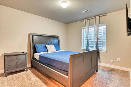 a bedroom with a bed and a dresser and a window at Family friendly 5bd3bath 3CarGarage GameRoom in Cimarron Hills
