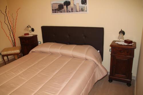 Ένα ή περισσότερα κρεβάτια σε δωμάτιο στο B&B A Casa Di Nonna