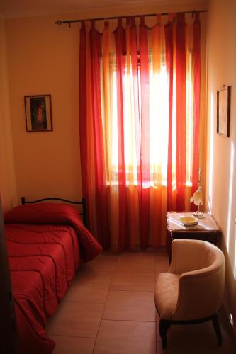 Ένα ή περισσότερα κρεβάτια σε δωμάτιο στο B&B A Casa Di Nonna