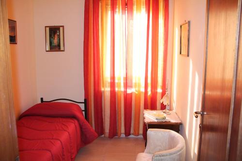 Ένα ή περισσότερα κρεβάτια σε δωμάτιο στο B&B A Casa Di Nonna