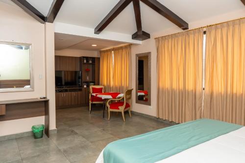 Ένα ή περισσότερα κρεβάτια σε δωμάτιο στο CRESPOTEL Hotel Boutique