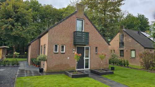 a brick house with a window on top of it at Vakantiewoning Maas en Waal in Ewijk